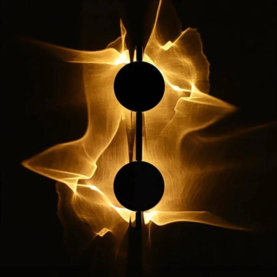 Adjustable Wall Sconce with Rotating Head and Reflective Metal Disc